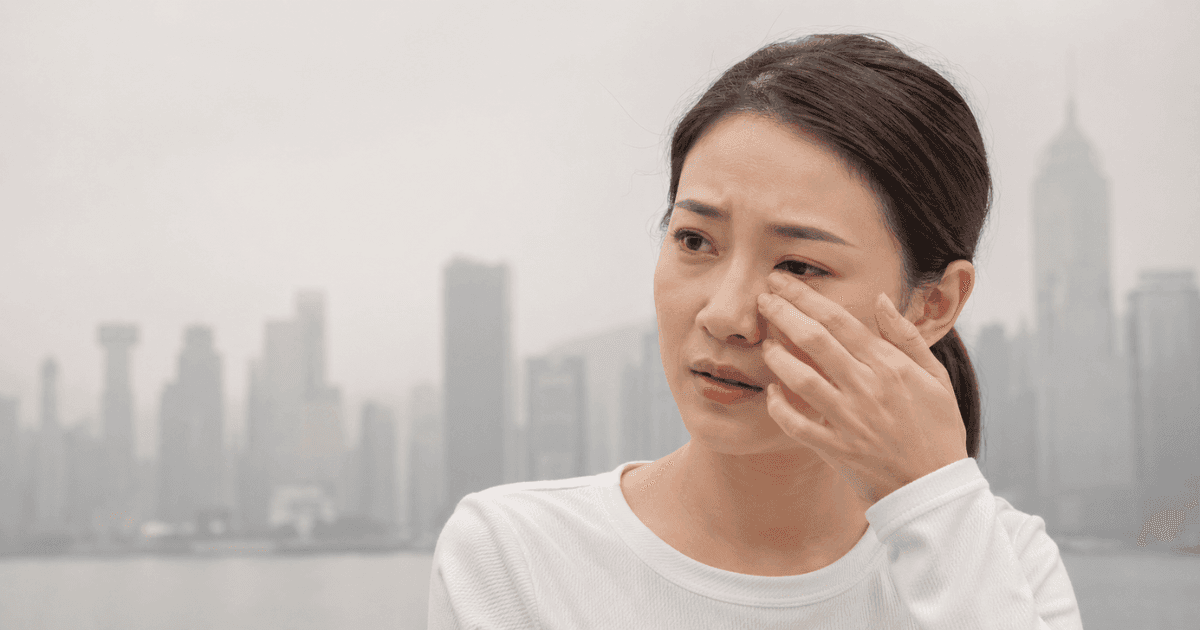 Person with red irritated eyes caused by haze exposure in Singapore