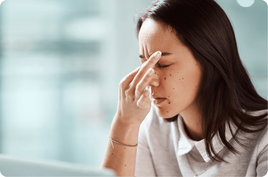 woman experiencing eye strain and headache from dry amd symptoms