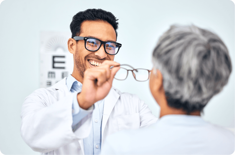 optometrist presenting prescription glasses for non-surgical vision correction